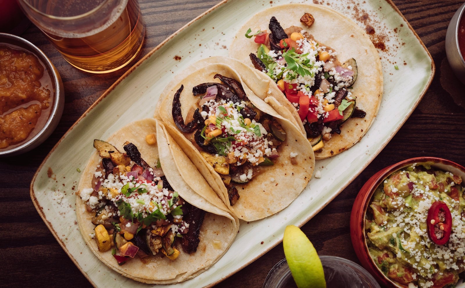 Tacos and salsa on a taquería counter in Chula Vista